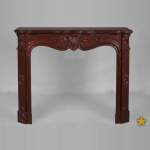 Antique Louis XV style fireplace with three shells decor in Red Griotte marble