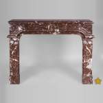 Antique Regence period fireplace in Red from the North marble