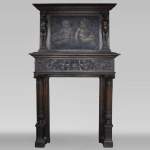 Antique Neo-Renaissance fireplace in oak with a painting with two putti