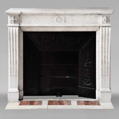 Louis XVI style fireplace in semi-statuary Carrara marble, decorated with a sunflower