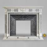 Beautiful Victorian style antique fireplace in Carrara Statuary marble and inlays of Vert d'Estours marble with vases and bowl