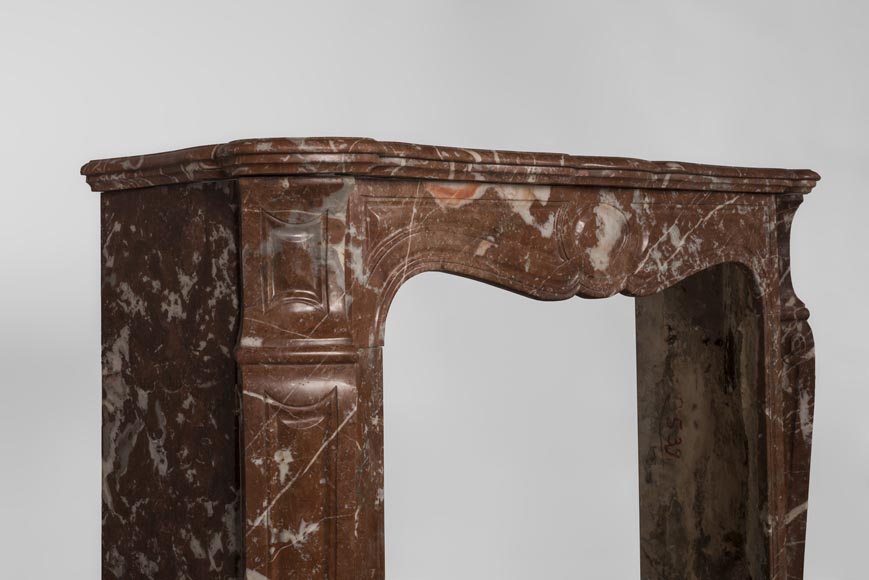 An antique Louis XV style fireplace, Pompadour model, made out of Rouge du Nord marble-4