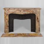 Exceptional antique Regence style fireplace in Sarrancolin Fantastico marble decorated with windings and acanthus leaves