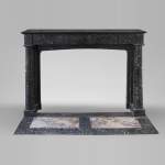 Antique Empire style fireplace made out of Noir moucheté marble with detached columns
