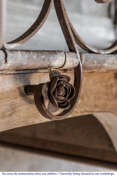 Beautiful spiral staircase with a wrought iron railing decorated with flowers and arabesques-2