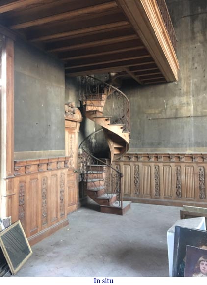 Beautiful spiral staircase with a wrought iron railing decorated with flowers and arabesques-7