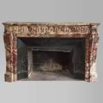 Antique Louis XVI style fireplace made out of marble with flutes