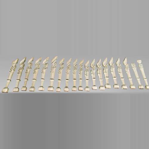 Set of painted carved wooden staircase balusters
