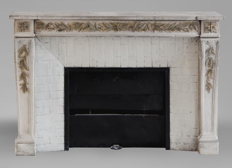 An antique Louis XVI style fireplace, made out of stone, with foliated decoration-0
