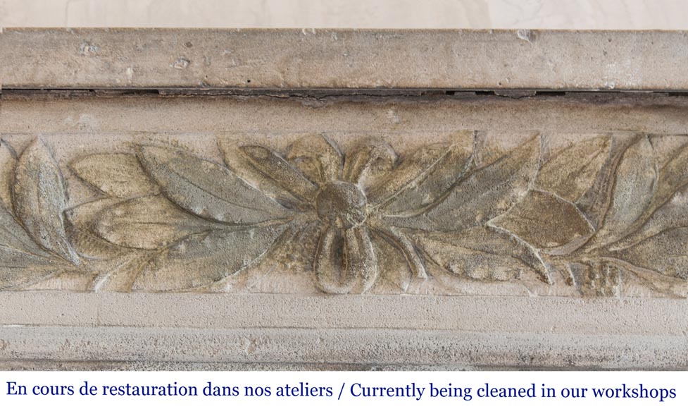 An antique Louis XVI style fireplace, made out of stone, with foliated decoration-1