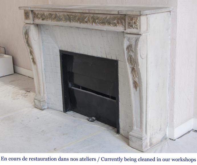 An antique Louis XVI style fireplace, made out of stone, with foliated decoration-6