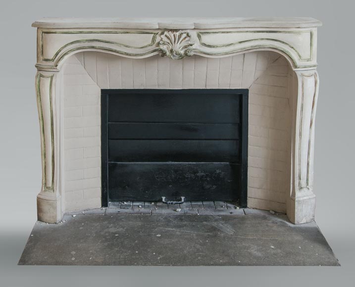 An antique Louis XV style fireplace, made out of stone-0