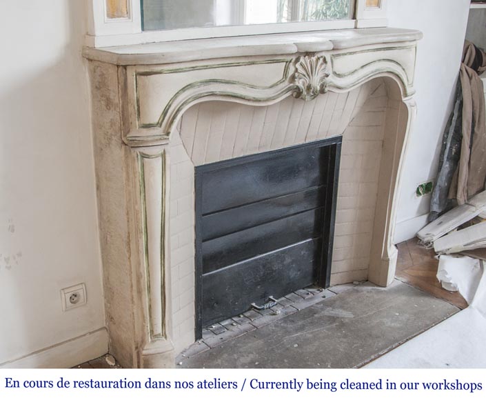 An antique Louis XV style fireplace, made out of stone-2