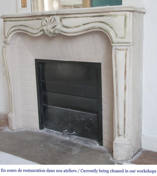 An antique Louis XV style fireplace, made out of stone-5