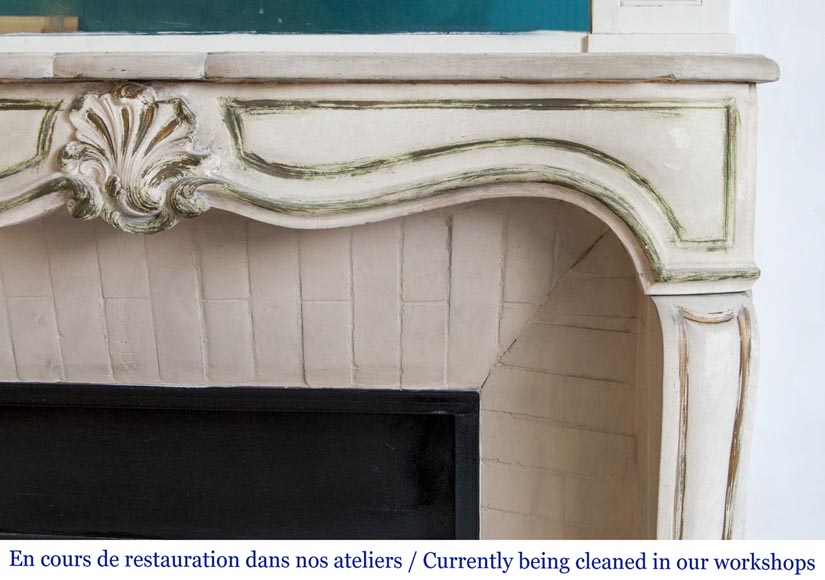 An antique Louis XV style fireplace, made out of stone-6