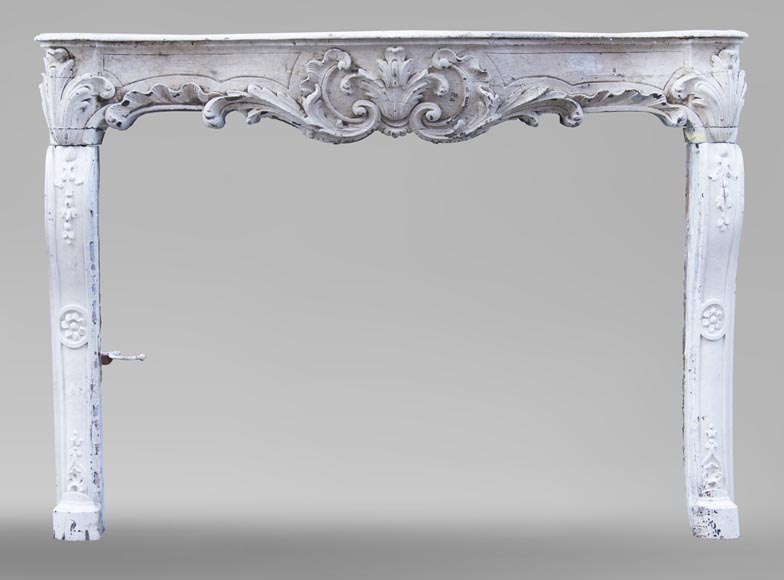 A beautiful antique richly sculpted fireplace from Louis XV period made out of painted oak-0