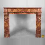 An antique Napoléon III style fireplace, made out of Breche Sanguine marble, with 