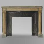 An antique Directoire style fireplace, made out of Rose du Portugal and Bleu Turquin marble