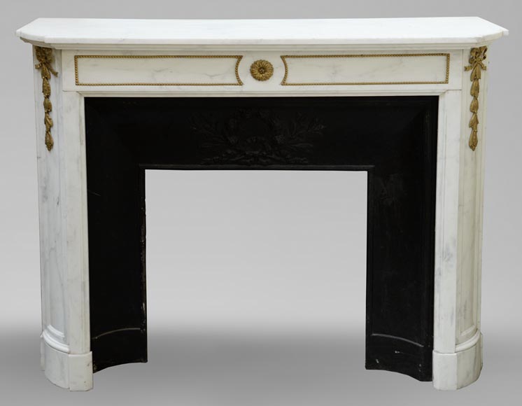 An antique Louis XVI style fireplace made out of Carrara marble with gilded bronze ornaments-0