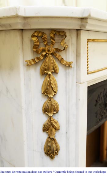 An antique Louis XVI style fireplace made out of Carrara marble with gilded bronze ornaments-3