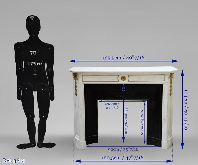 An antique Louis XVI style fireplace made out of Carrara marble with gilded bronze ornaments-9