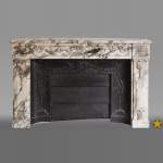 Antique Louis XVI style fireplace made out of Breche Violette marble