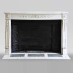 Antique Louis XVI style fireplace made of semi statuary marble decorated with laurel branches