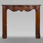 18th century carved walnut fireplace with large shell