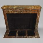 Antique Louis XVI style fireplace with round corners in Red from the North marble and gilded bronze ornaments