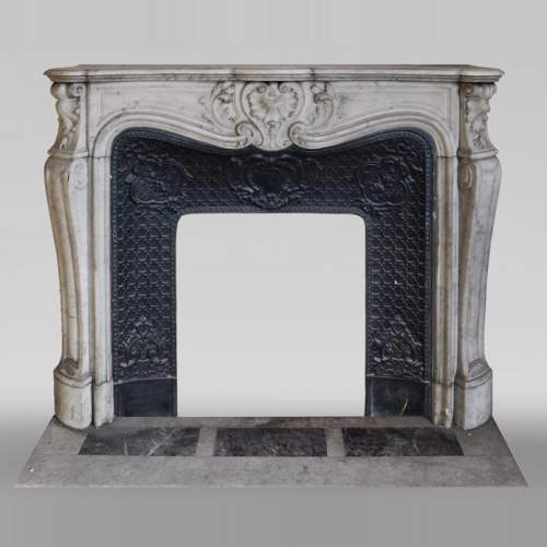 Beautiful antique Louis XV style fireplace with foliaged shell in white