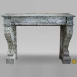 Antique Restoration style fireplace mantel in Bleu Fleuri marble