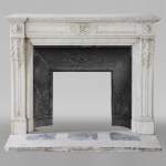 Antique Louis XVI style fireplace with acanthus leaf decoration in Carrara marble