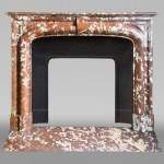 Antique Louis XIV style fireplace in Rouge Languedoc marble