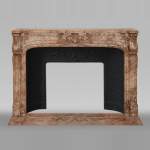 Antique Regence style mantel richly sculpted in Sarrancolin Ilhet marble