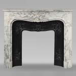 Regence style scrolled mantel carved in Arabescato marble