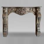Antique Louis XV period mantel in wood, richly sculpted