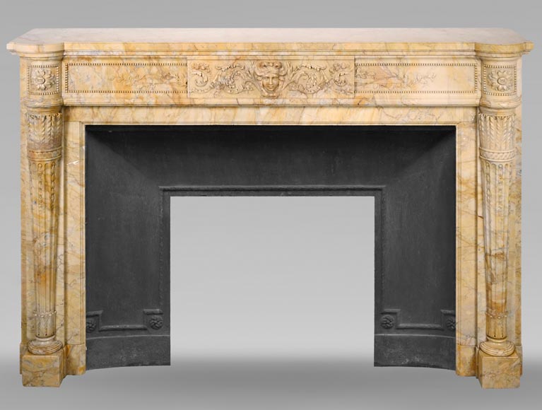 Large Louis XVI style mantel in yellow Sienna marble with entablature adorned with the head of Apollo and arrow heads on the jambs-0