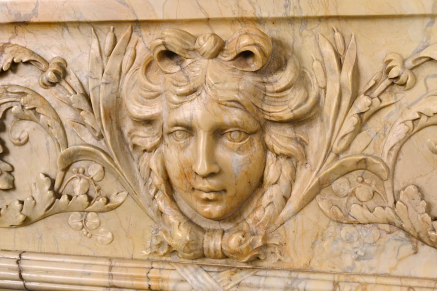 Large Louis XVI style mantel in yellow Sienna marble with entablature adorned with the head of Apollo and arrow heads on the jambs-4