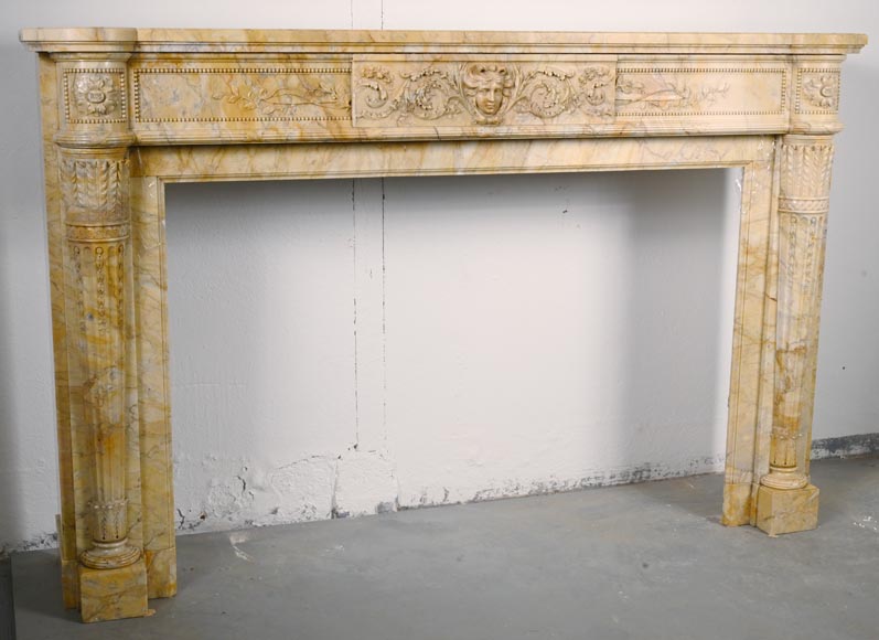 Large Louis XVI style mantel in yellow Sienna marble with entablature adorned with the head of Apollo and arrow heads on the jambs-5