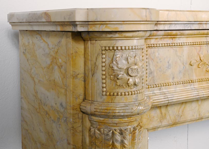Large Louis XVI style mantel in yellow Sienna marble with entablature adorned with the head of Apollo and arrow heads on the jambs-7