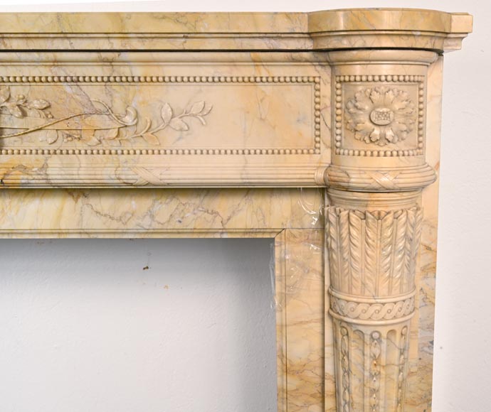Large Louis XVI style mantel in yellow Sienna marble with entablature adorned with the head of Apollo and arrow heads on the jambs-10