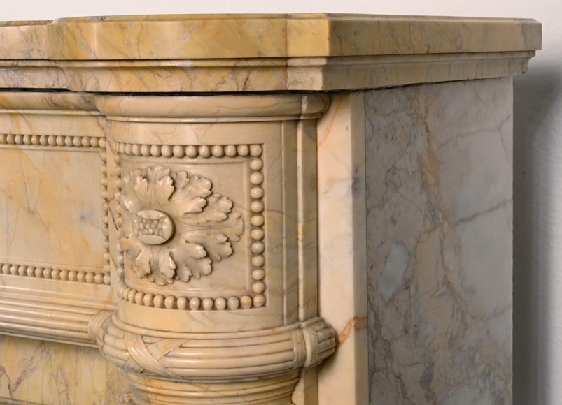 Large Louis XVI style mantel in yellow Sienna marble with entablature adorned with the head of Apollo and arrow heads on the jambs-11