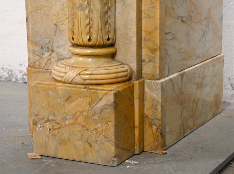 Large Louis XVI style mantel in yellow Sienna marble with entablature adorned with the head of Apollo and arrow heads on the jambs-12
