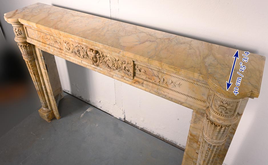 Large Louis XVI style mantel in yellow Sienna marble with entablature adorned with the head of Apollo and arrow heads on the jambs-13