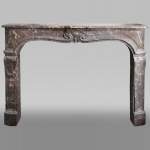 Important Louis XV period fireplace in Rouge du Nord marble
