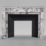Louis XVI style mantel with fluted legs carved in Sarravenza marble