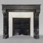 Small fireplace with modillions in Black marble