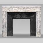 Louis XVI style mantel with rounded corners carved in Breche de Médicis