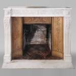 Louis XVI fireplace of white marble with a Greek frieze