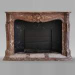 Beautiful Louis XV style fireplace in Red of the North marble